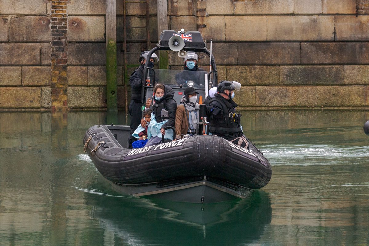 Migrants are brought ashore by a RNLI lifeboat in Dover, UK on May 23, 2022 [Stuart Brock/Anadolu Agency]