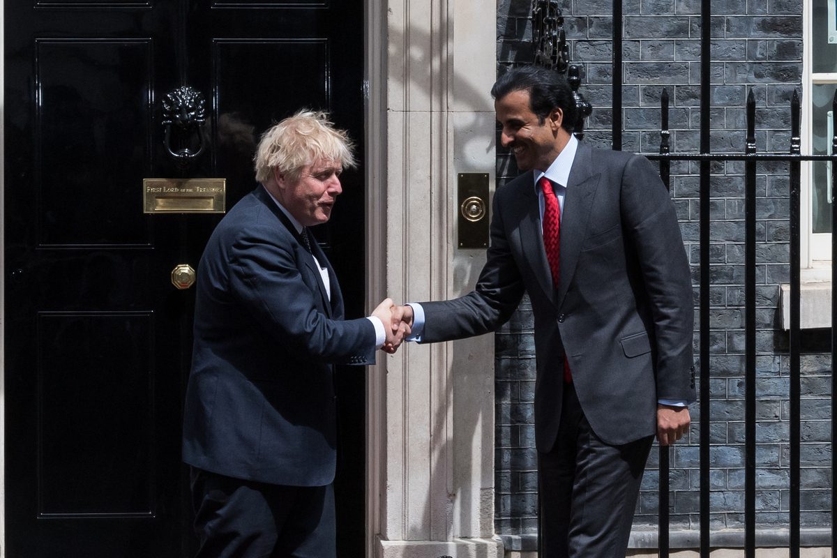 British Prime Minister Boris Johnson (L) welcomes Emir of Qatar Sheikh Tamim Bin Hamad Al Thani (R) outside 10 Downing Street ahead of their bilateral meeting in London, United Kingdom on May 24, 2022 [Wiktor Szymanowicz/Anadolu Agency]