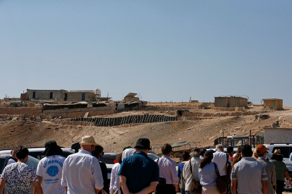 A group of European Union Heads of Mission along with Israeli NGOS Breaking the Silence and B'Tselem visit Palestinian communities in the Masafer Yatta area in the South Hebron Hills on October 19, 2020 [HAZEM BADER/AFP via Getty Images]