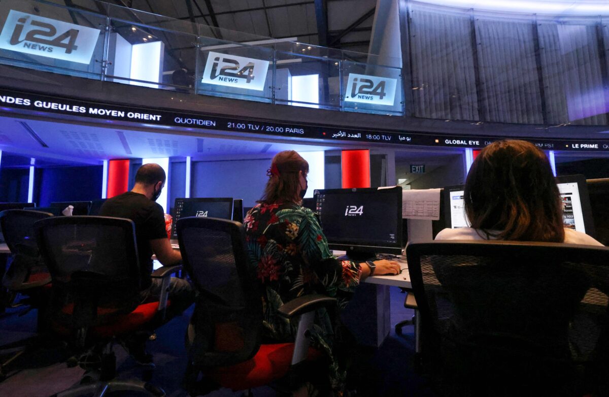 Employees of I24, work at the news channel's headquarters in the Israeli port city of Jaffa near Tel Aviv, on July 15, 2021. - I24 News which went live on July 17, 2013, is an Israeli international 24-hour news channel that broadcasts in French, English and Arabic. (Photo by Emmanuel DUNAND / AFP) (Photo by EMMANUEL DUNAND/AFP via Getty Images)