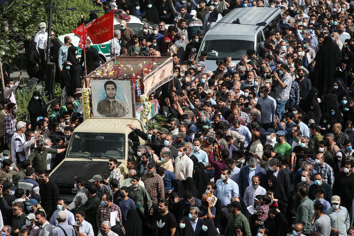 Iranian people attending the Funeral of Iran's Revolutionay Guards colonel Sayad Khodaei on May 24, 2022 in Tehran, Iran. [Meghdad Madadi ATPImages/Getty Images]