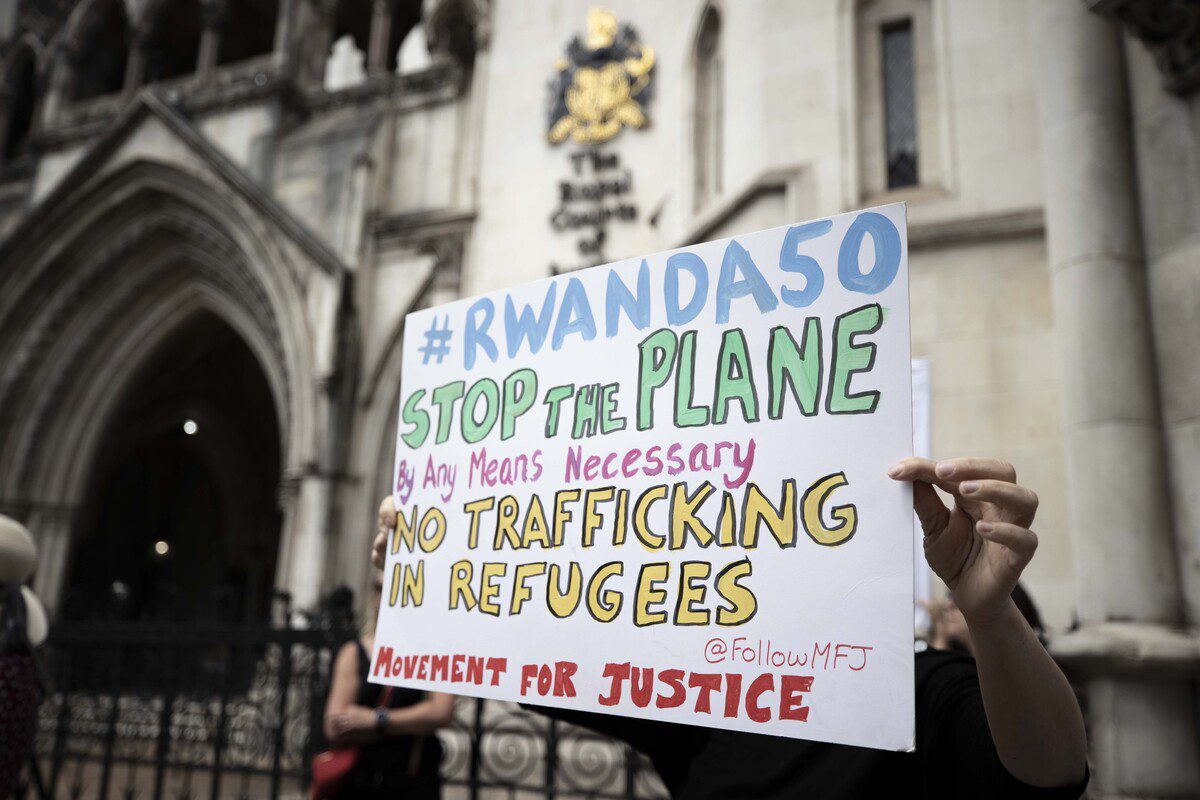 Protesters demonstrate outside the Supreme Court against the Home Office's plan to relocate individuals identified as illegal immigrants or asylum seekers to Rwanda for processing, resettlement and asylum in London, United Kingdom on June 13, 2022. [Raşid Necati Aslım - Anadolu Agency]