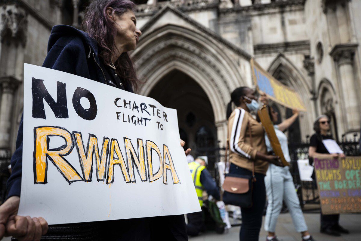 Protesters demonstrate outside the Supreme Court against the Home Office's plan to relocate individuals identified as illegal immigrants or asylum seekers to Rwanda for processing, resettlement and asylum in London, United Kingdom on June 13, 2022 [Raşid Necati Aslım/Anadolu Agency]