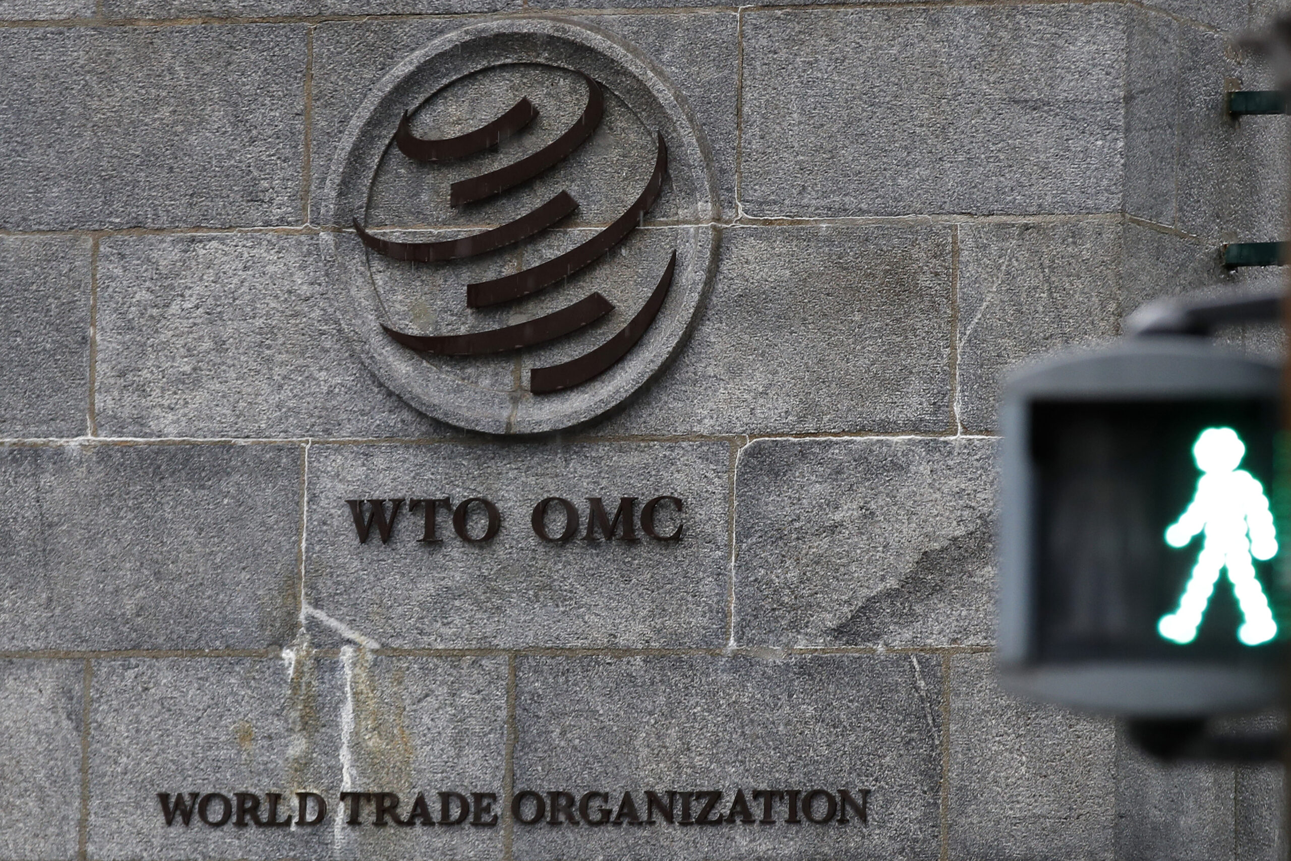 A logo stands on the wall outside the World Trade Organisation (WTO) headquarters in Geneva, Switzerland on 2 March 2020 [Stefan Wermuth/Bloomberg/Getty Images]