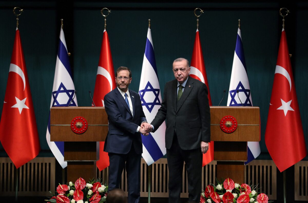 Israeli President Isaac Herzog (L) and his Turkish counterpart Tayyip Erdogan shake hands during a press conference in Ankara, on March 9, 2022. (Photo by AFP) (Photo by STR/AFP via Getty Images)