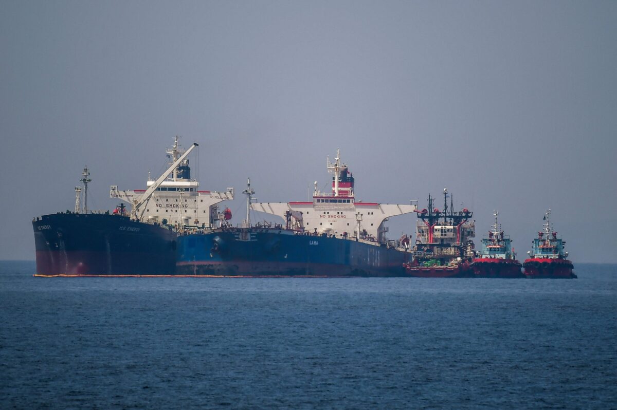 The Liberian-flagged oil tanker Ice Energy (L) transfers crude oil from the Russian-flagged oil tanker Lana (R) (former Pegas), off the shore of Karystos, on the Island of Evia, on May 29, 2022. - Greece will send Iranian oil from a seized Russian-flagged tanker to the United States at the request of the US judiciary, Greek port police said Wednesday, a decision that angered Tehran. Last month the Greek authorities seized the Pegas, which was said to have been heading to the Marmara terminal in Turkey. The authorities seized the ship in accordance with EU sanctions introduced after Russia invaded Ukraine in February. (Photo by Angelos Tzortzinis / AFP) (Photo by ANGELOS TZORTZINIS/AFP via Getty Images)