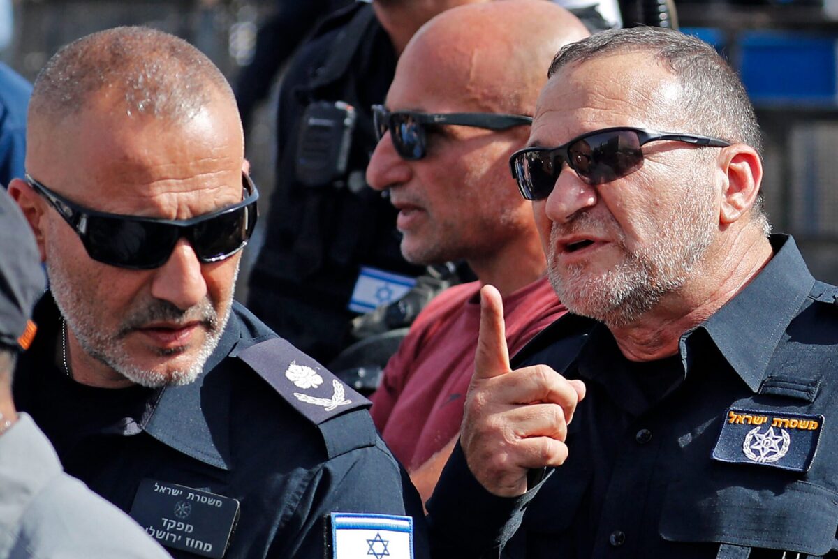 Israeli Police Commissioner Yaakov Shabtai (R) is seen near the Damascus Gate of the old city of Jerusalem [AHMAD GHARABLI/AFP via Getty Images]