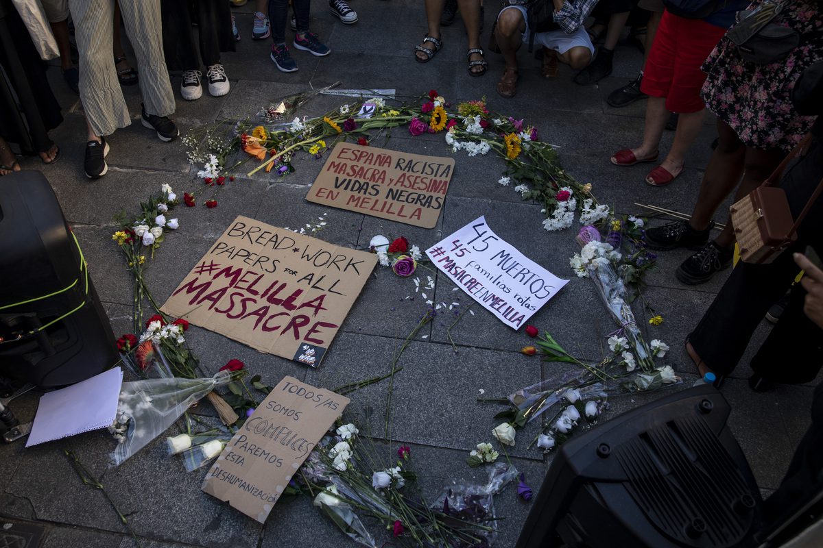 Flowers are laid on the ground in memory of migrants who died at the Spanish-Moroccan border [Pablo Blazquez Dominguez/Getty Images]