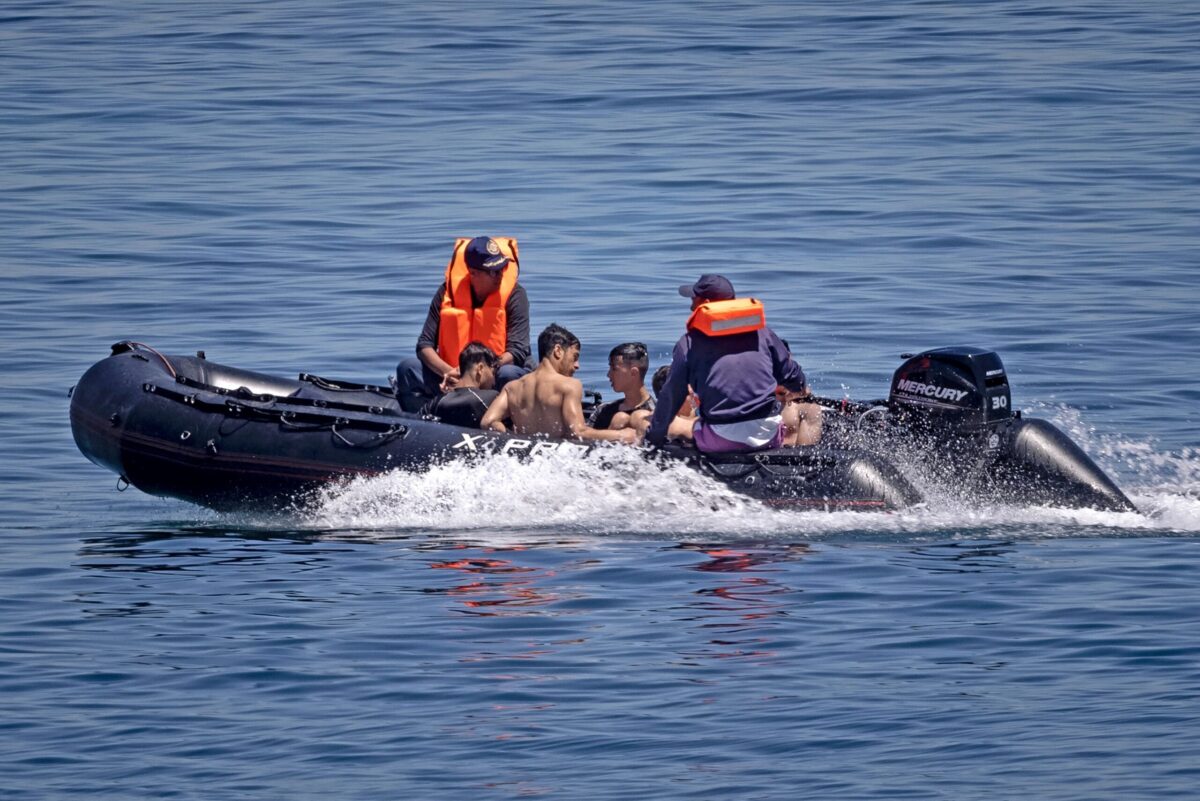 Royal Moroccan Navy officers intercept migrants. [FADEL SENNA/AFP via Getty Images]