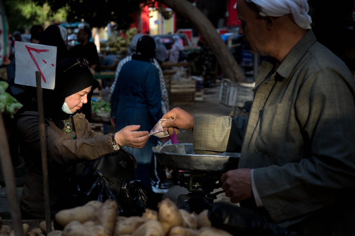A customer pays at a market in Cairo, Egypt on 1 June 2022 [Islam Safwat/Bloomberg/Getty Images]