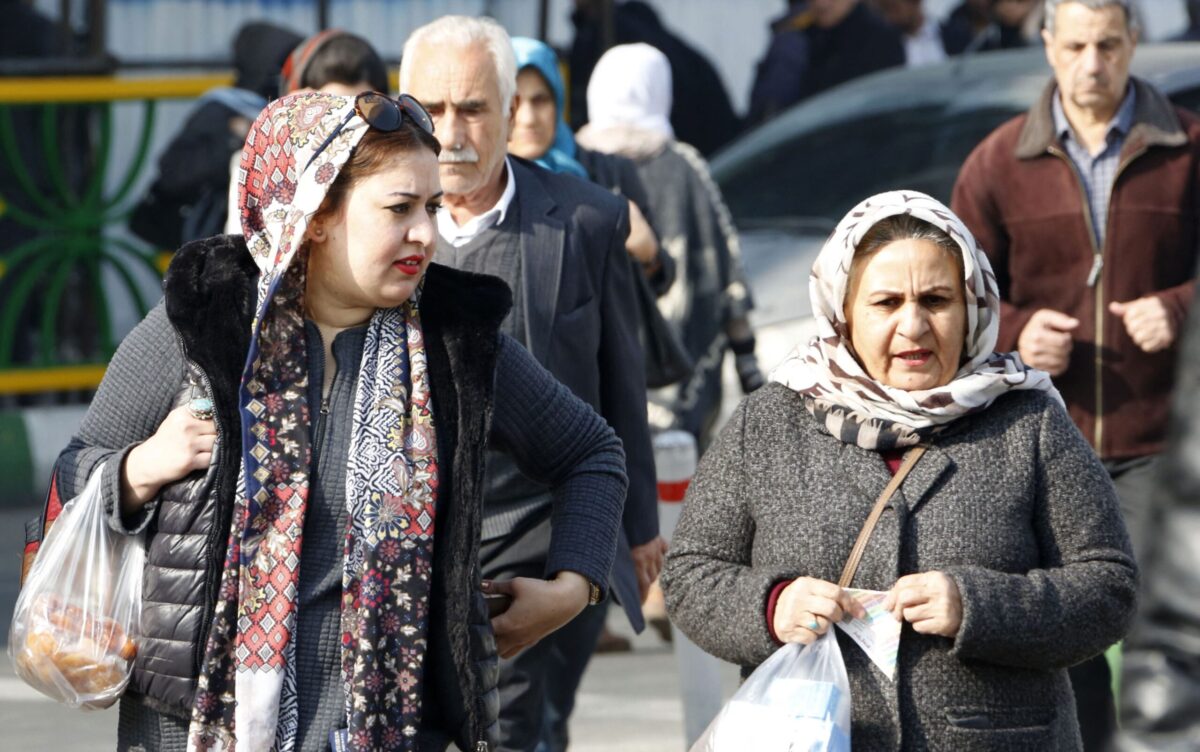 Iranian women wearing hijab walk down a street in the capital Tehran on February 7, 2018. - A spate of unprecedented protests against Iran's mandatory headscarves for women have been tiny in number, but have still reignited a debate that has preoccupied the Islamic republic since its founding. (Photo by ATTA KENARE / AFP) (Photo by ATTA KENARE/AFP via Getty Images)
