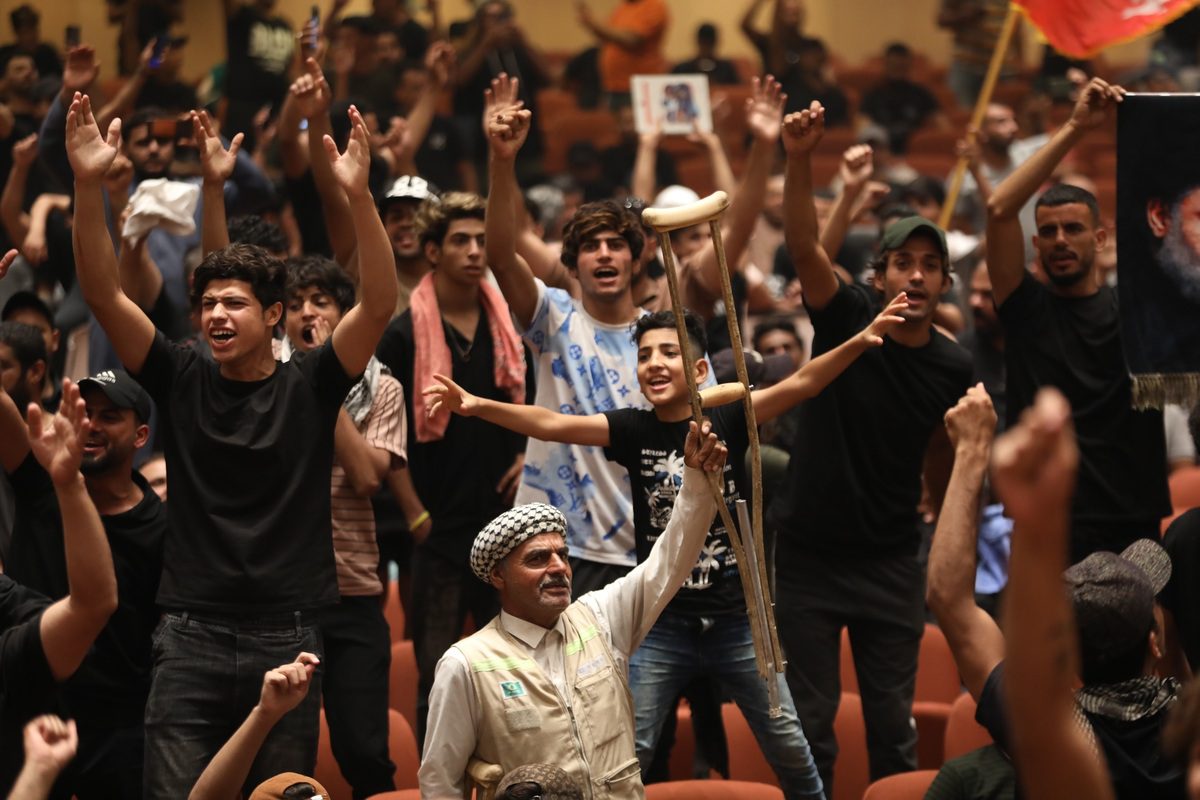 Supporters of Shiite cleric Moqtada al-Sadr storm the Iraqi parliament building in Baghdad's fortified Green Zone in Baghdad, Iraq on July 31, 2022 [Murtadha Al-Sudani/Anadolu Agency]