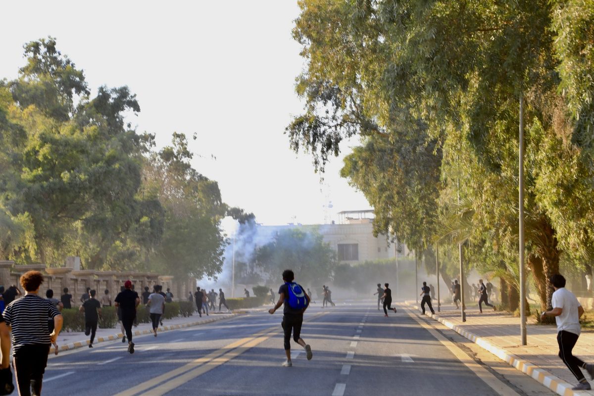 Security forces intervene in supporters of Iraqi cleric Muqtada al-Sadr after they stormed the Presidential Palace at Green Zone in Baqhdad, Iraq on August 29, 2022. [Murtadha Al-Sudani - Anadolu Agency]