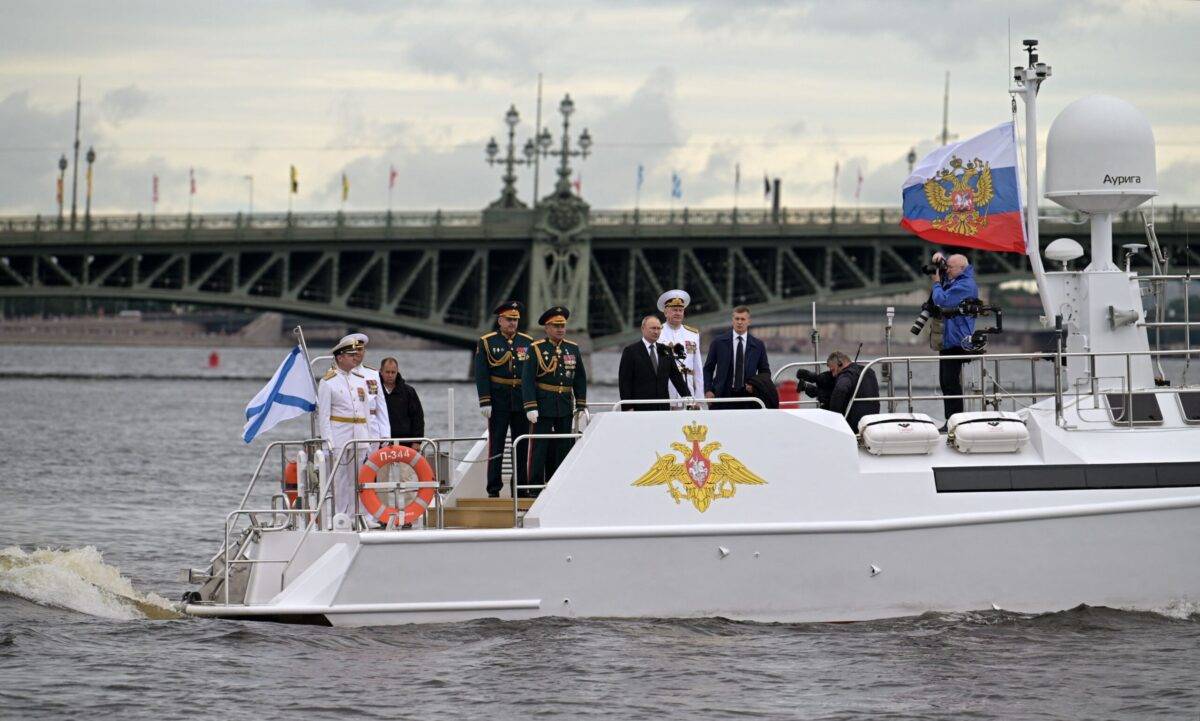 Russia's President Vladimir Putin takes part in the main naval parade marking the Russian Navy Day, in St. Petersburg on July 31, 2022 [Photo by PAVEL BYRKIN/Sputnik Host Photo Agency/AFP via Getty Images]
