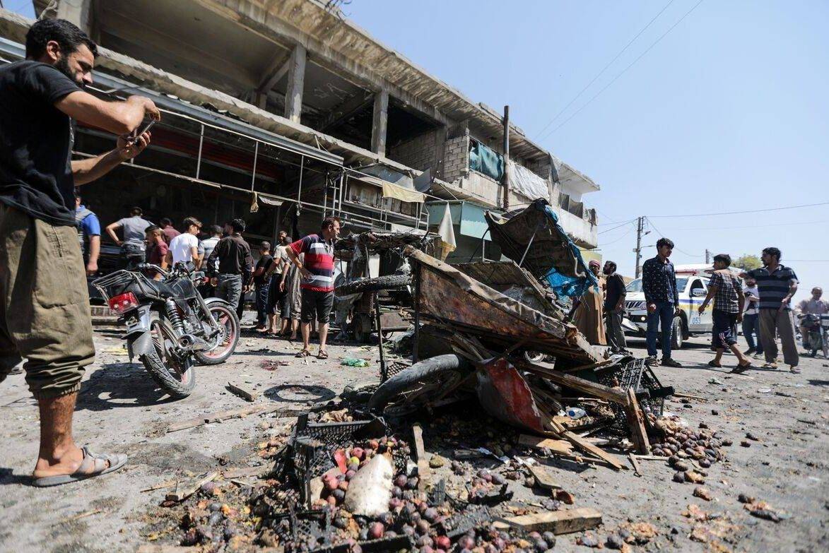 People gather of a bomb blast at a market in Al-Bab, Syria on 19 August 2022 [BAKR ALKASEM/AFP/Getty Images]