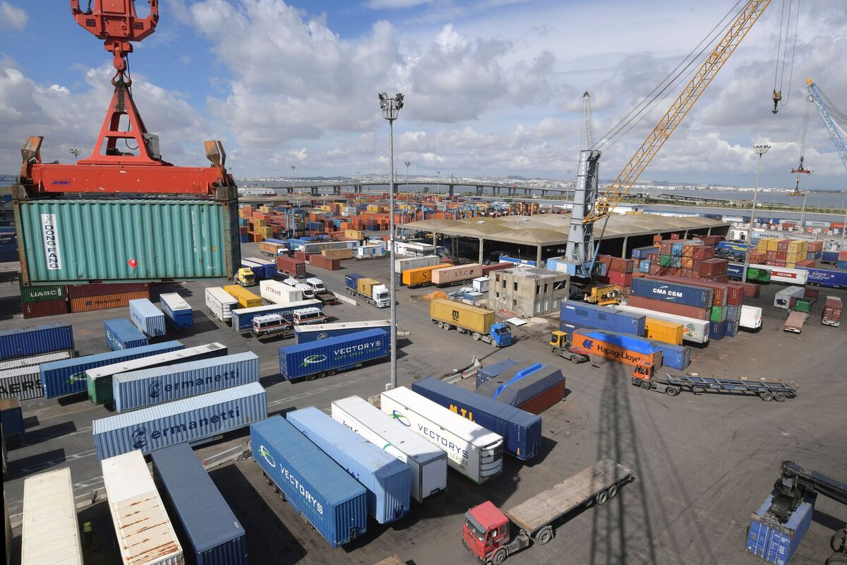 Shows containers being transported at the port of Rades in Tunis on October 5, 2018, [Photo by FETHI BELAID / AFP]