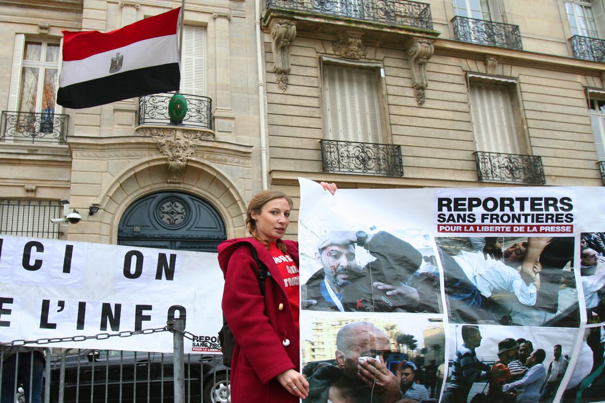 An activist of France-based international non-governmental organization "Reporters sans frontieres" (Reporters without borders) takes part in fa demonstration in front of the Egyptian embassy on February 4, 2011 in Paris, [MELANIE COSSIN/AFP via Getty Images]
