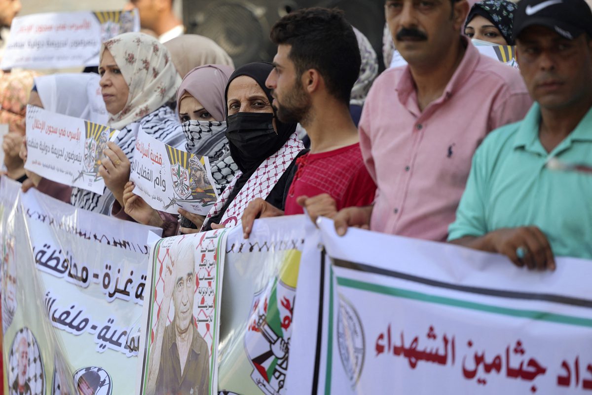 Protesters take part in a demonstration in support of hunger-striking Palestinian prisoners in Israeli jails, outside the International Committee of the Red Cross headquarters, in Gaza City, on August 29, 2022 [MOHAMMED ABED/AFP via Getty Images]