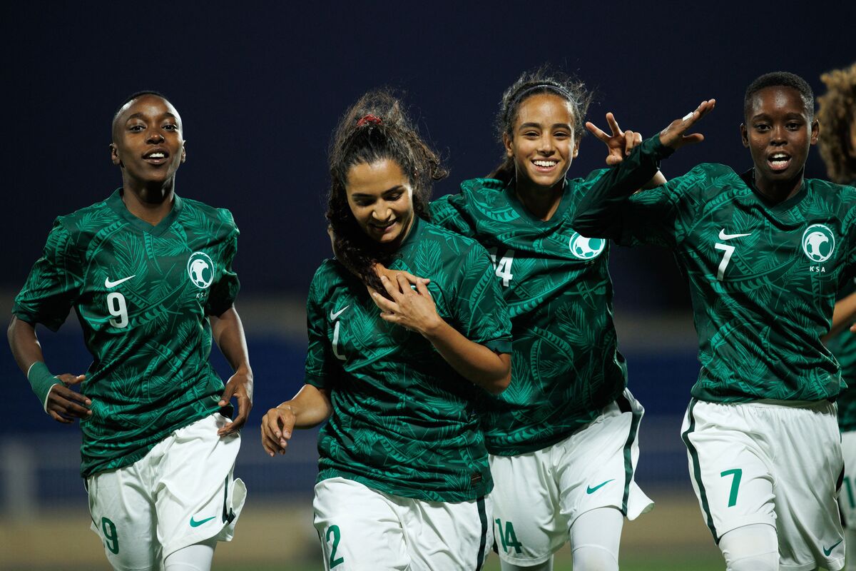 Saudi Arabia's Bayan Sadagah (C-L) celebrates her goal during a friendly football match between Saudi Arabia and Bhutan at Prince Sultan bin Abdulaziz stadium in Abha on September 24, 2022 [Photo by AFP) (Photo by -/AFP via Getty Images]