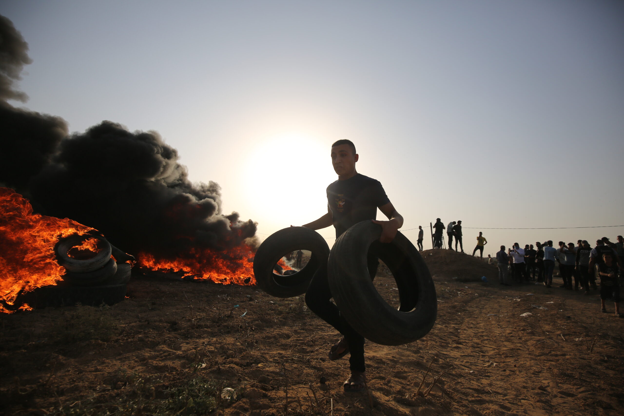 Palestinians protest at fence separating Gaza from Israel following Israel’s escalations and siege on Palestinian towns in the occupied West Bank [Mohammed Asad/Middle East Monitor]