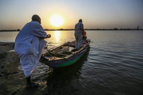 Fishermen make preparations on their boat before setting sail to the Nile River in Omdurman, Sudan on October 20, 2022. [Mahmoud Hjaj - Anadolu Agency]