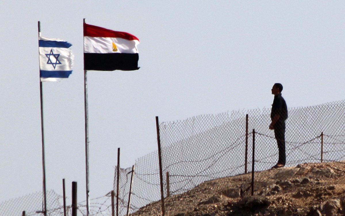 An Egyptian soldier stands guard at the Taba crossing between Egypt and Israel [MAHMUD KHALED/AFP via Getty Images]