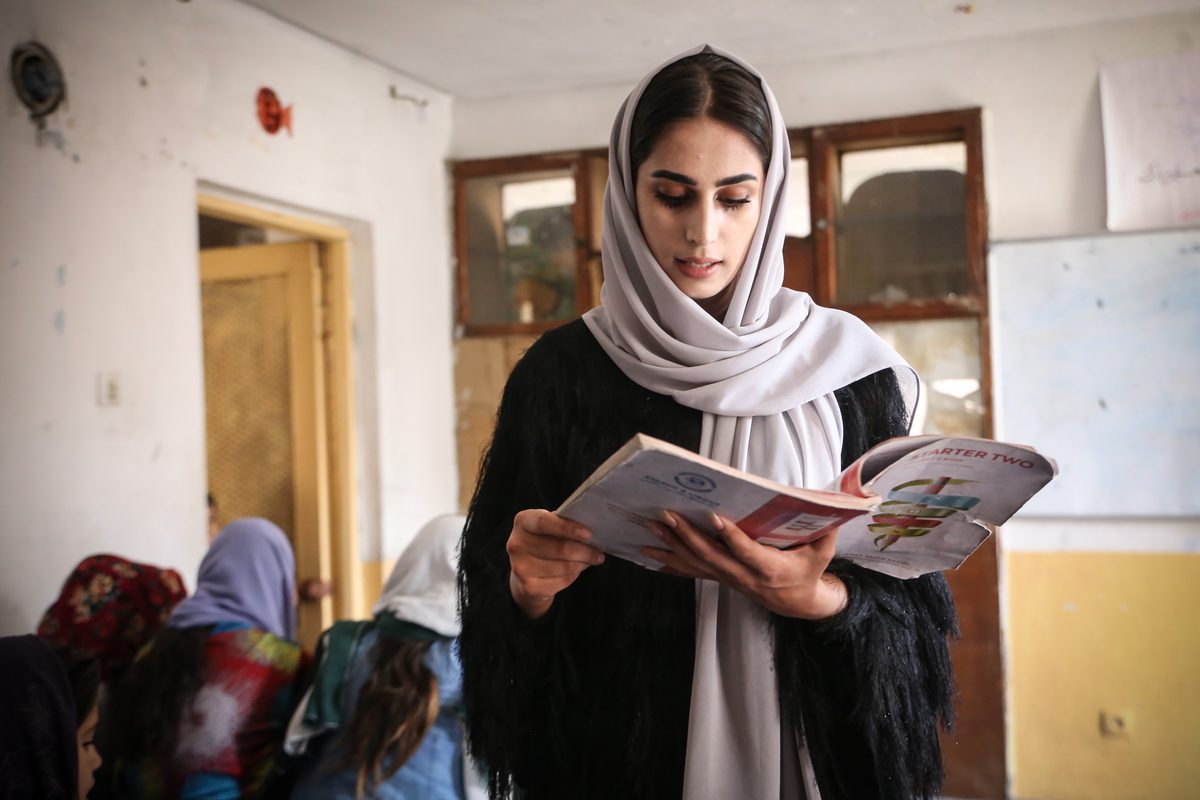 Afghan volunteer sisters, Sodabe Nezend (21) and Azita Nezend (23) educate Afghan girls of middle and high school ages who are not allowed to have an education, child workers, and illiterate women at the school that they established through their own means in Kabul, Afghanistan on October 31, 2022 [Bilal Güler - Anadolu Agency]