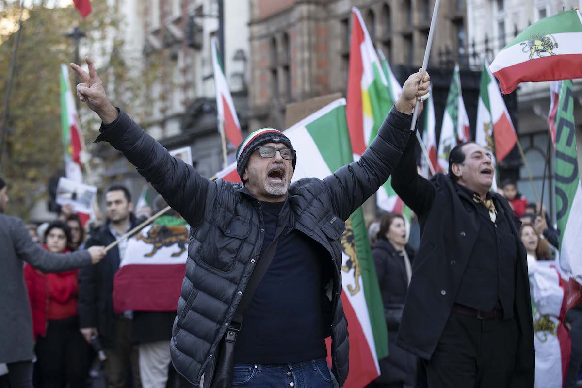 People take part in a march to support the demonstrations that started following the death of 22-year-old Mahsa Amini in police custody in Tehran, on November 19, 2022 [Raşid Necati Aslım/Anadolu Agency]