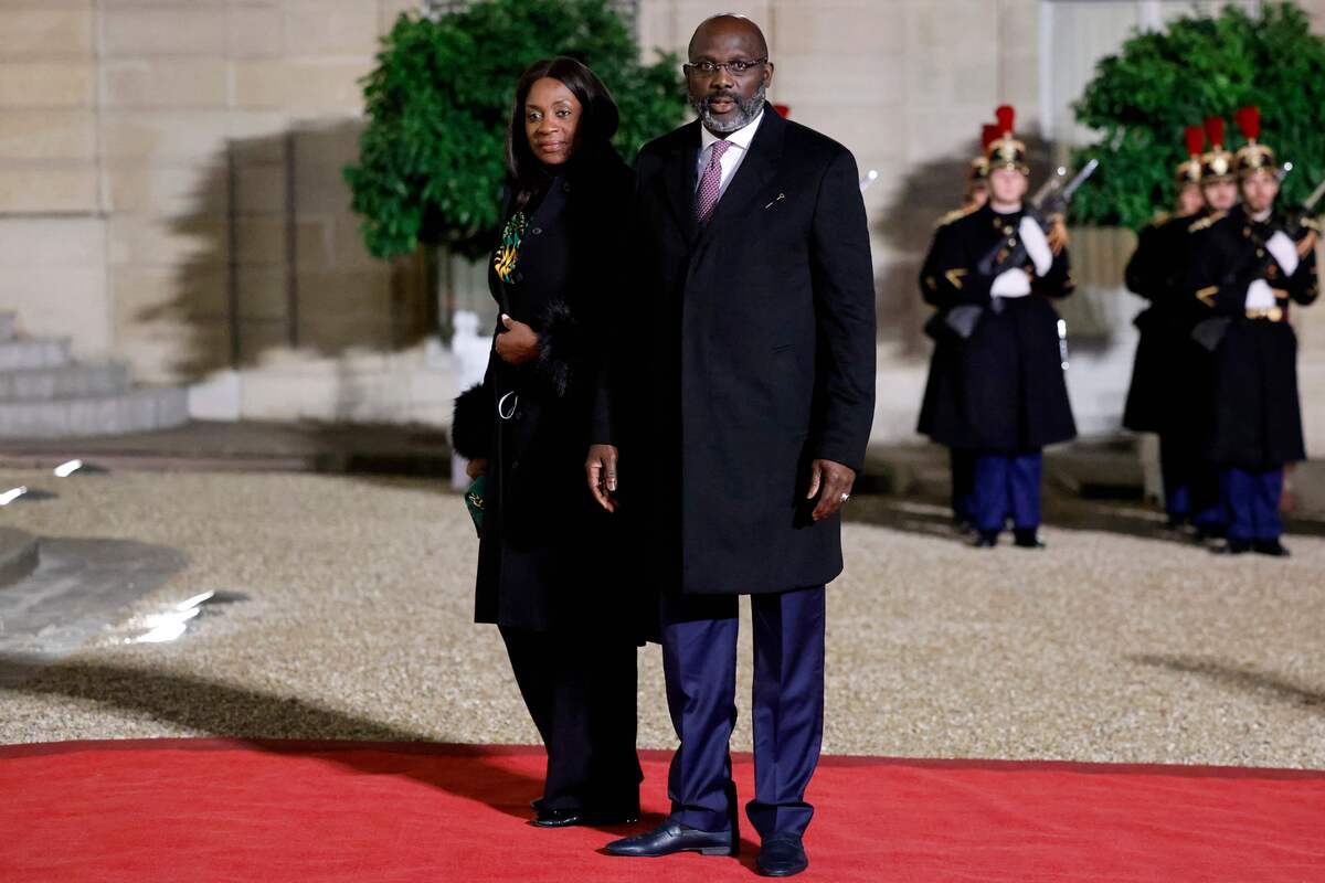 Liberia President Georges Weah (R) and his wife Clar Weah arrive for the Paris [LUDOVIC MARIN/AFP via Getty Images]