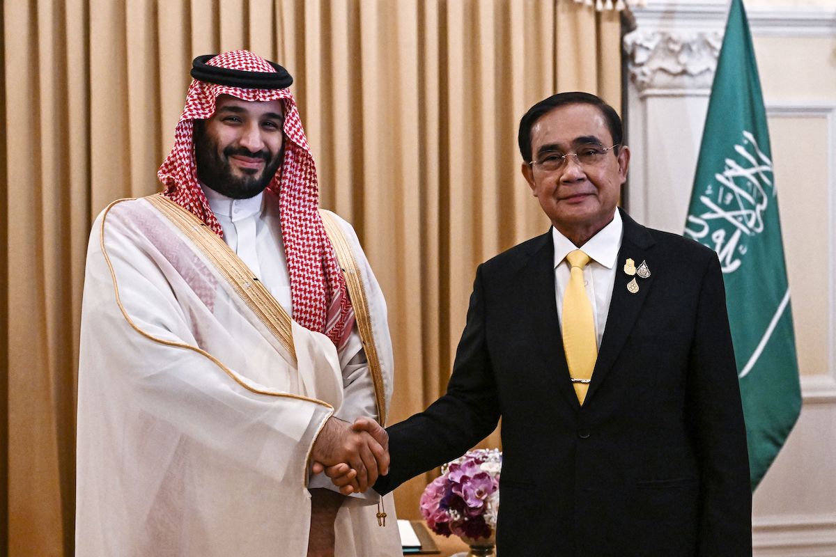 Saudi Crown Prince Mohammed bin Salman shakes hands with Thailand's Prime Minister Prayut Chan-o-cha at Goverment House in Bangkok on November 18, 2022, during the Asia-Pacific Economic Cooperation (APEC) summit. [LILLIAN SUWANRUMPHA/POOL/AFP via Getty Images]