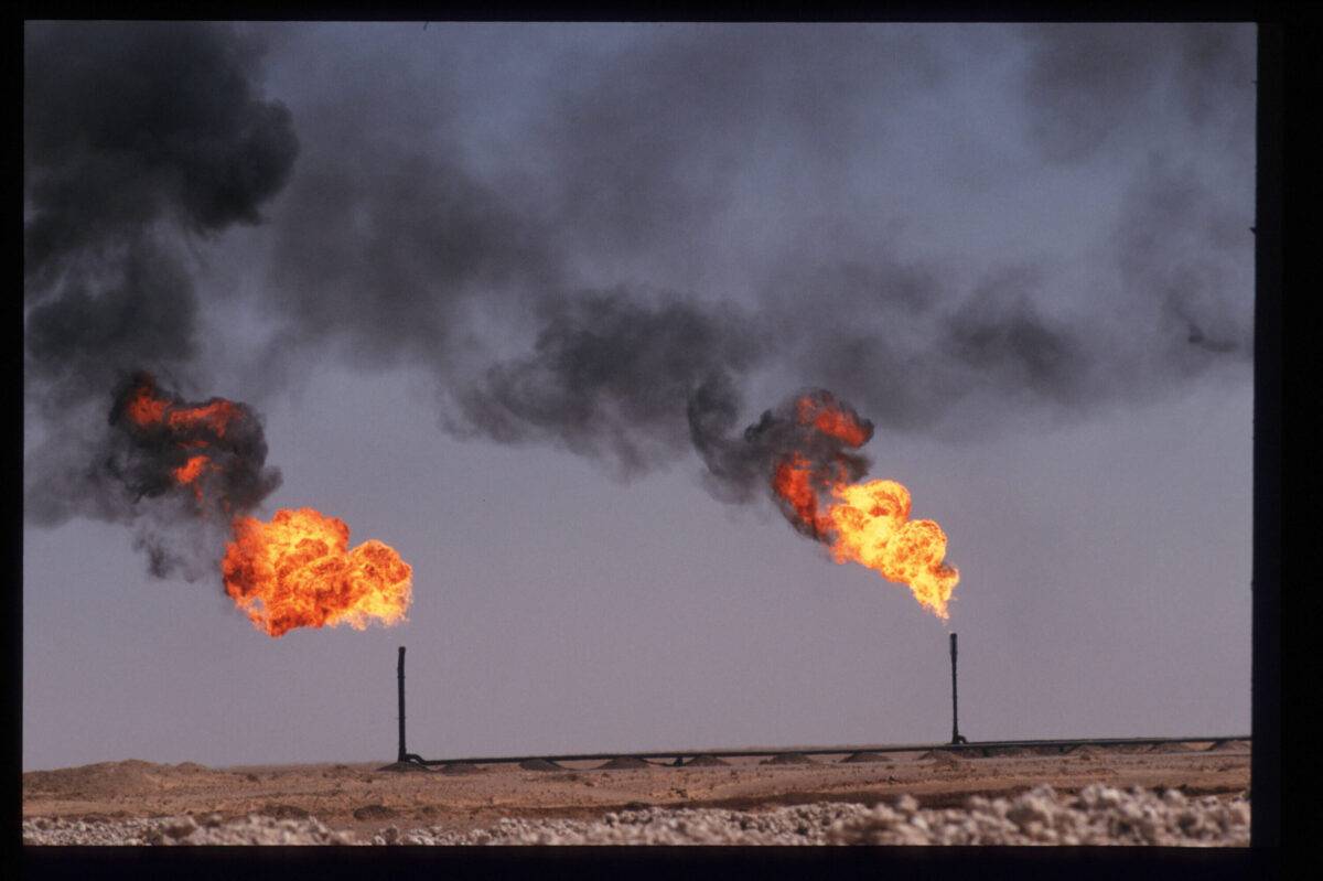 Flames indicate gas burn off at an oil drilling platform [Scott Peterson/Liaison]