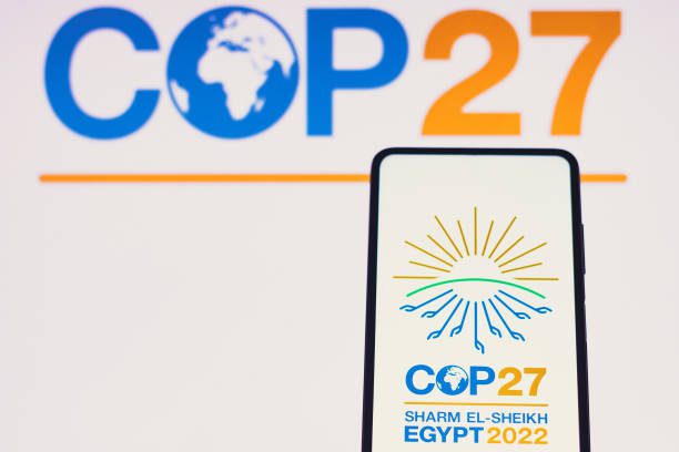 In this photo illustration, the 2022 United Nations Climate Change Conference COP27 logo is seen on a smartphone screen [Rafael Henrique/SOPA Images/LightRocket via Getty Images]