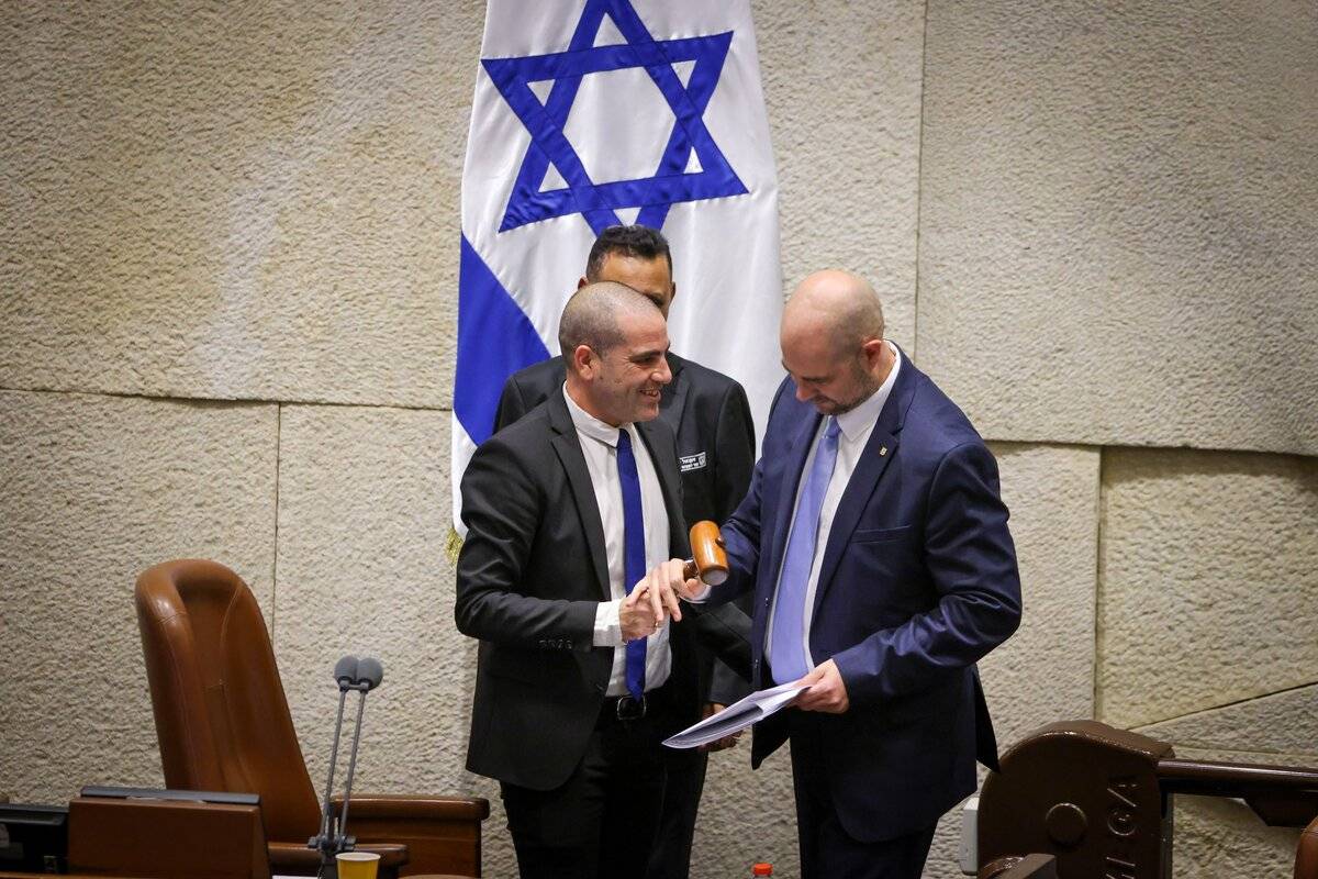 Israeli new speaker of the Knesset (parliament) Amir Ohana (L) receives his gavel as the new government is sworn in at the Israeli parliament in Jerusalem on December 29, 2022. [Israeli Parliament (Knesset) - Anadolu Agency]