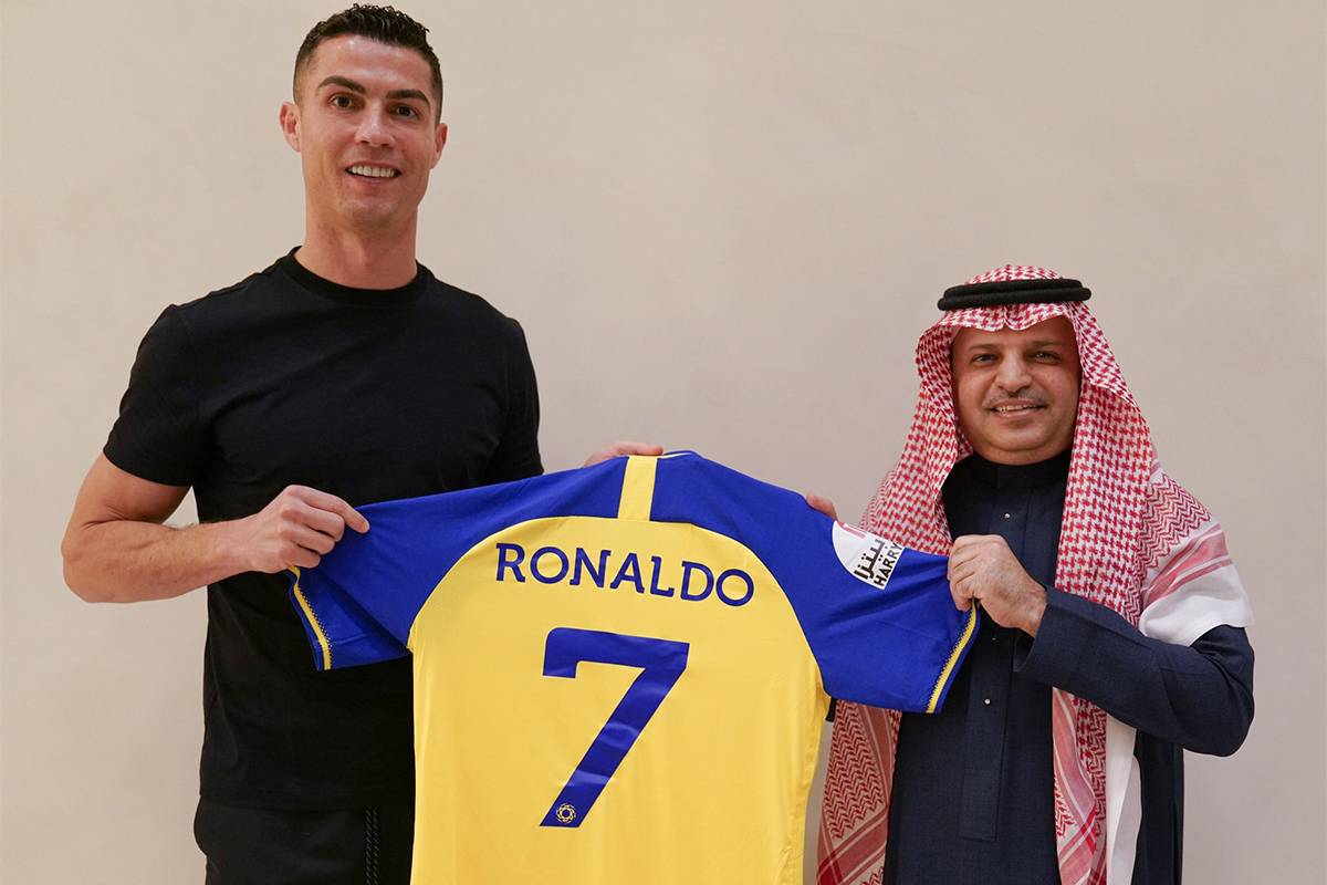 Portuguese football star Cristiano Ronaldo poses for a photo with the jersey after signing with Saudi Arabia's Al-Nassr Football Club in Riyadh, Saudi Arabia on December 30, 2022. [Al Nassr FC / Handout - Anadolu Agency]