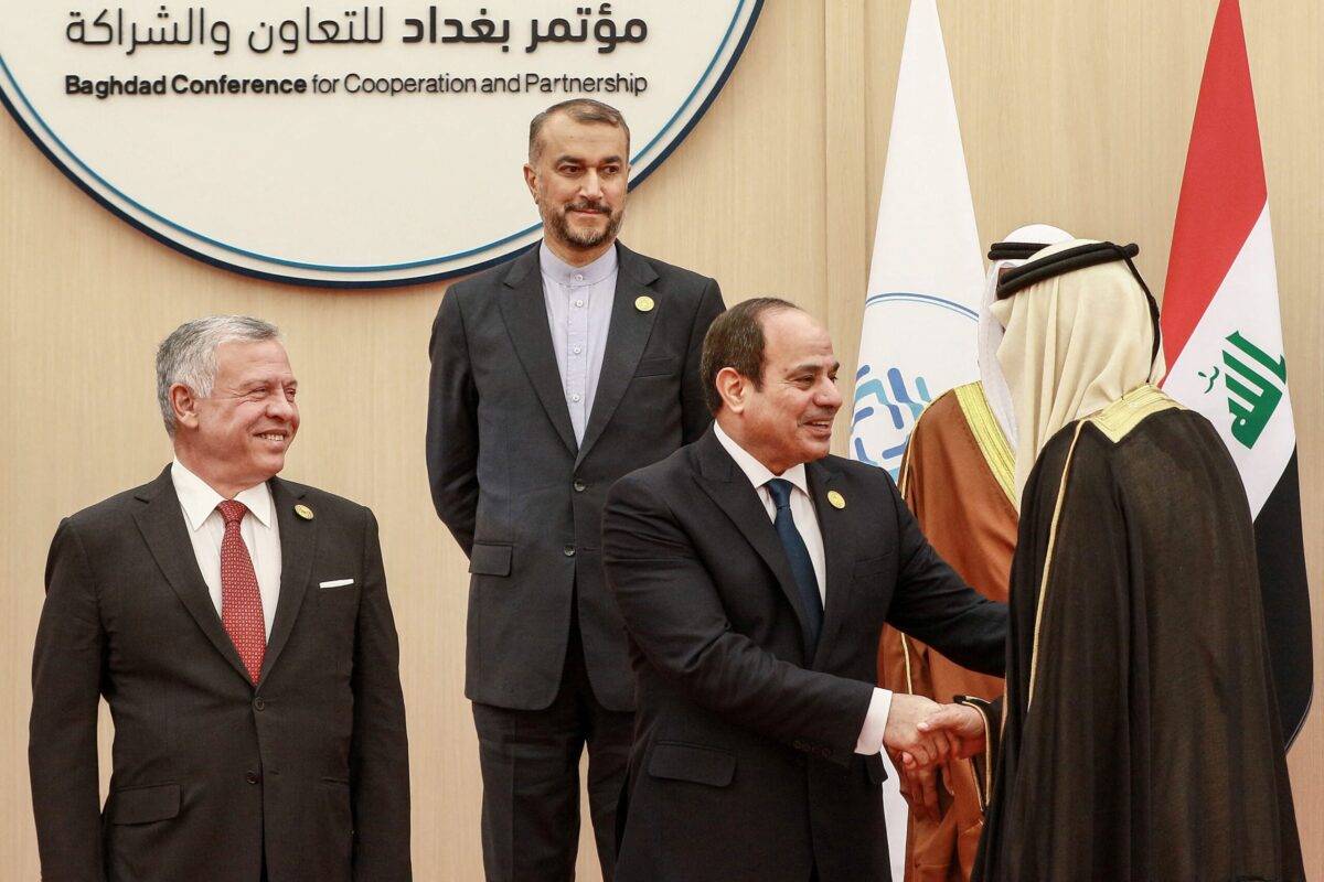 Jordan's King Abdullah II (L) and Iranian Foreign Minister Hossein Amir-Abdollahian (top) look on as Egypt's President Abdel Fattah al-Sisi (C) shakes hands with another dignitary [KHALIL MAZRAAWI/AFP via Getty Images]