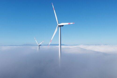 The wind turbines in Metristepe Village of Bozuyuk district spin among the fog clouds in Bilecik, Turkiye on January 8, 2023. [Muhsin Arslan - Anadolu Agency]