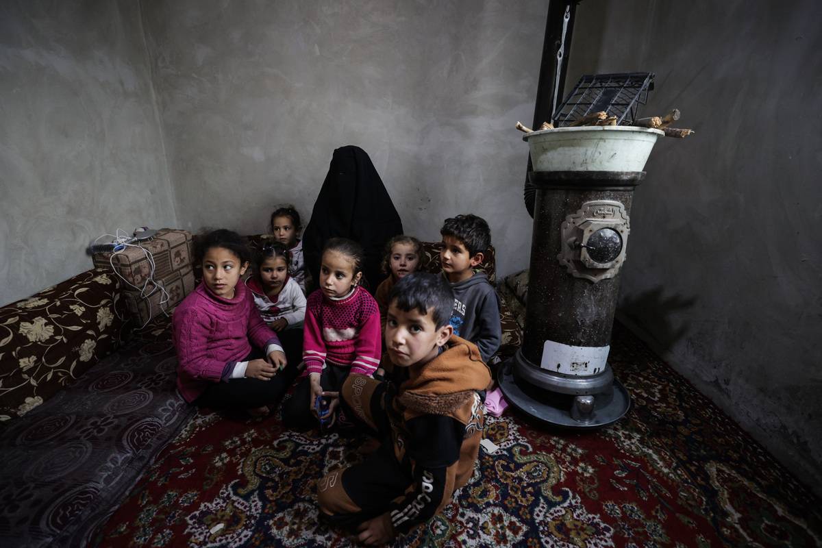 Children are seen in a briquette house, delivered to their family by Human Movie Team and IHH Humanitarian Relief Foundation in Sharran town of Afrin district in Aleppo, which was cleared of the terrorist organization PKK/YPG as a result of Operation Olive Branch, on January 7, 2023 [Esra Hacioğlu Karakaya - Anadolu Agency]