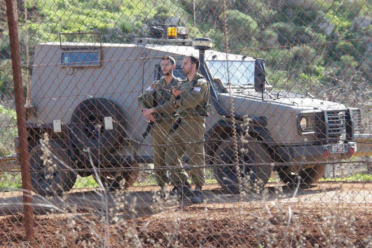 Israeli soldiers are seen as Lebanese soldiers prevent Israeli army's heavy duty machines to operate at the border near "Blue Line", which is under surveillance of United Nations Interim Force In Lebanon, claiming the Israeli army violate the Lebanese soil in Kfarkela, Lebanon on January 19, 2023. [Ali Abdo - Anadolu Agency]