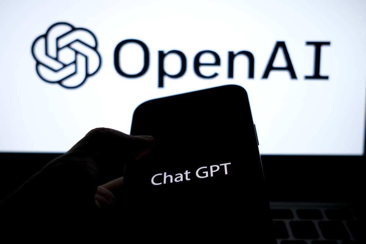 In this photo illustration, logo of "Chat GPT" is displayed on a mobile phone screen in front of a computer screen displaying logo of "OpenAI" in Ankara, Turkiye on January 25, 2023 [Muhammed Selim Korkutata - Anadolu Agency]