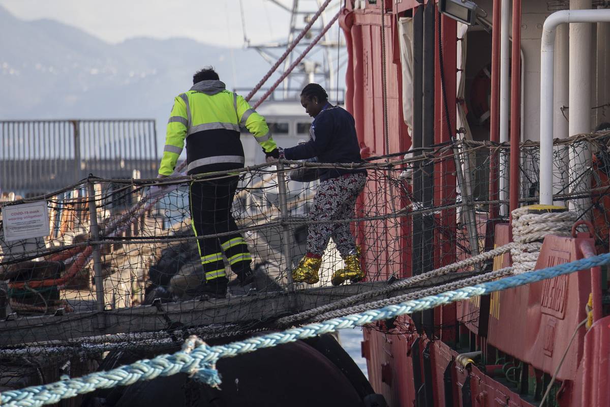 A migrant gets off the Sea-eye4 ship of the German NGO Sea-eye in the port of Naples, Southern Italy on February, 6 2023. [Stringer - Anadolu Agency]