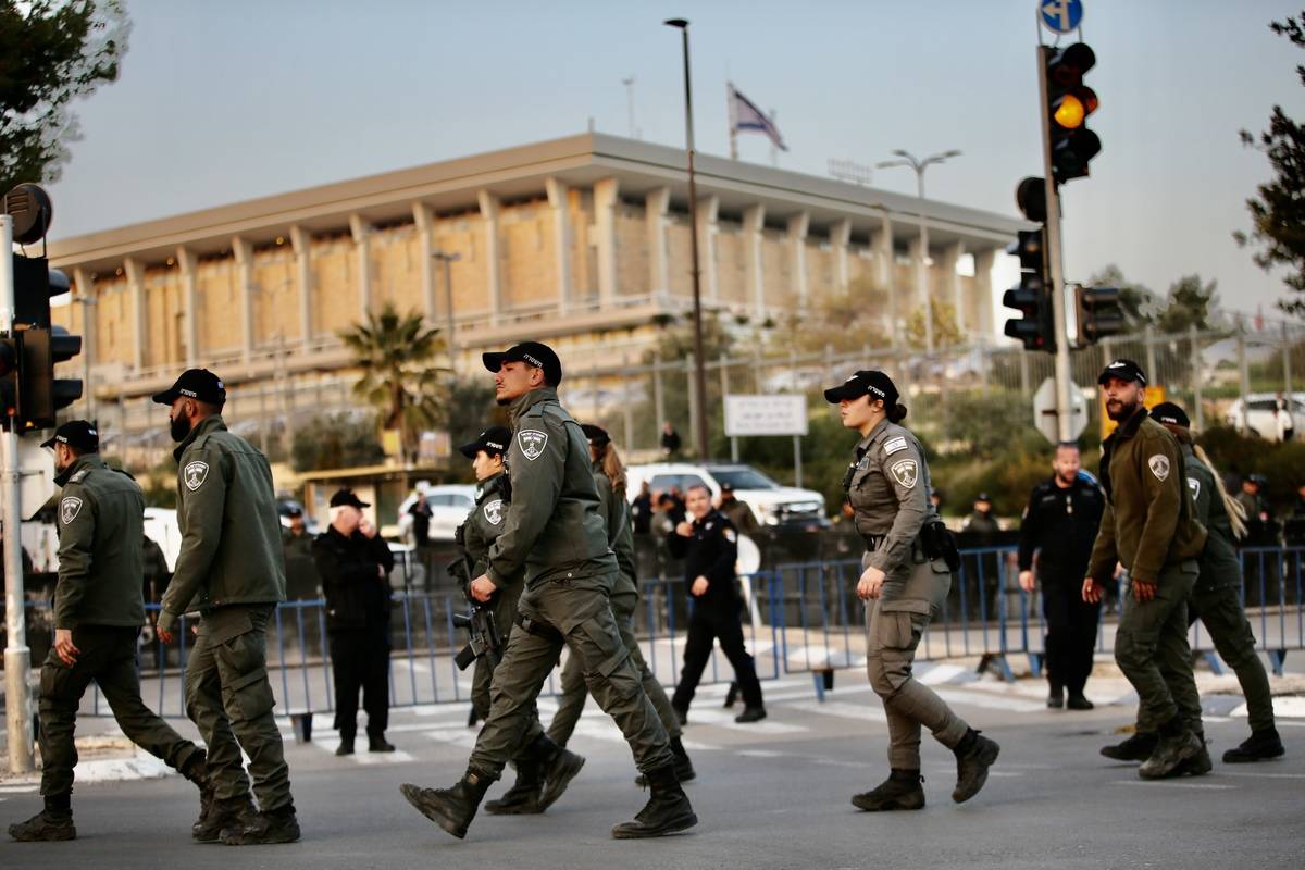 Police officers take security measures as Israeli non-governmental organizations gather in front of the parliament building (Knesset) [Mostafa Alkharouf - Anadolu Agency]