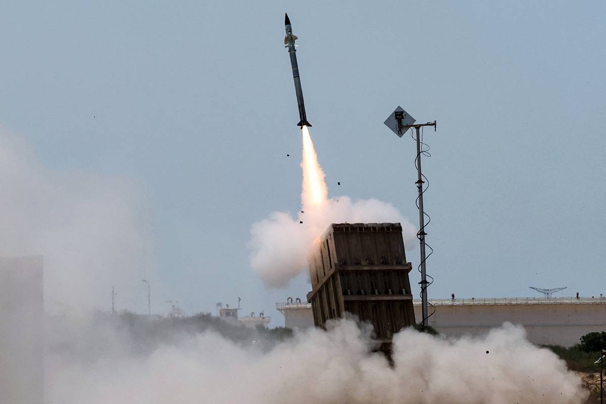 An Israeli Iron Dome air defence system launches a missile to intercept rockets fired. [Photo by JACK GUEZ/AFP via Getty Images]