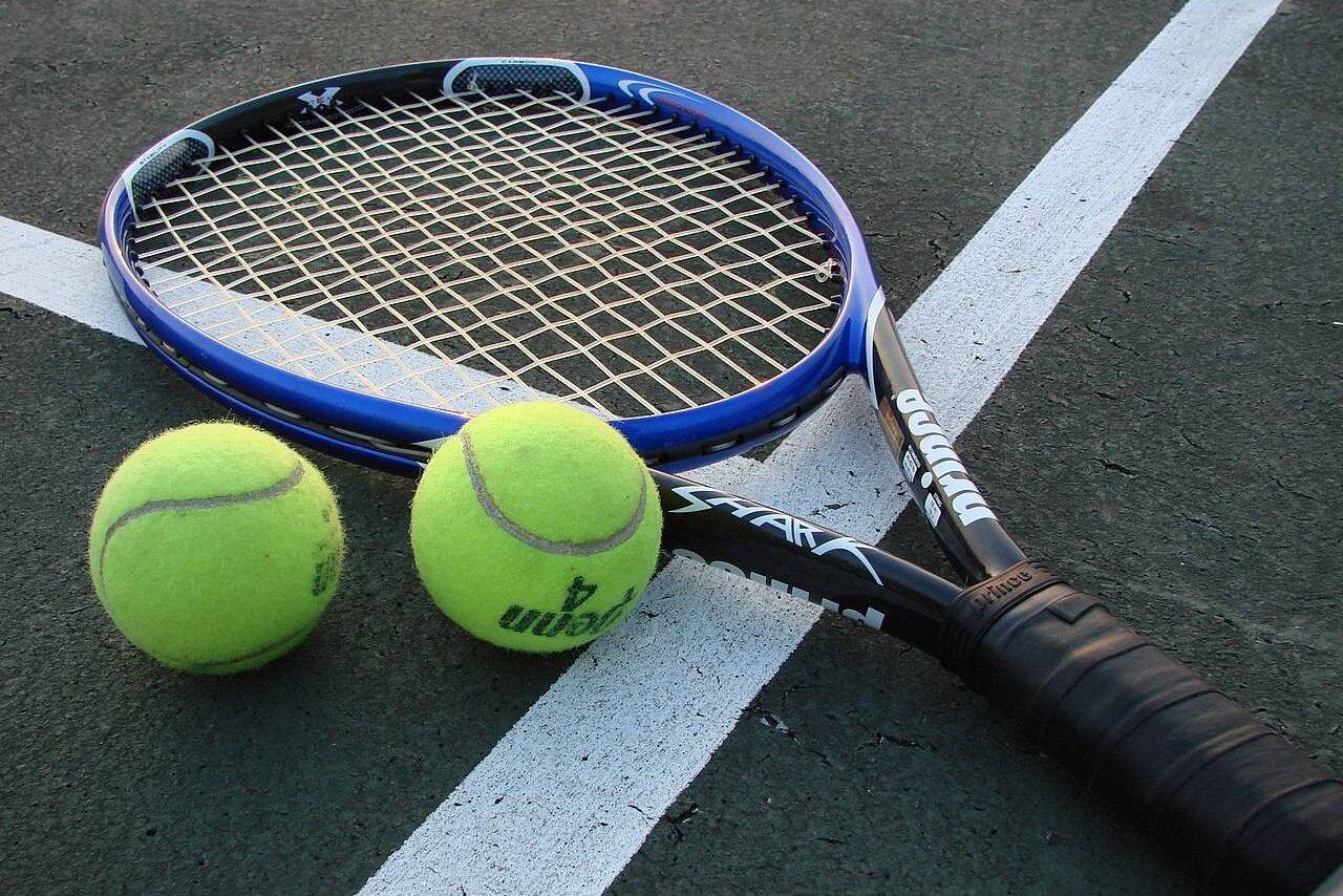 A modern tennis racket, with carbon fiber-reinforced polymer frame [wikipedia]