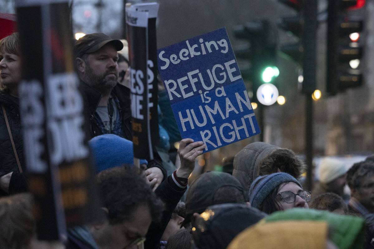 Pro-migrant protesters gather in the Parliament Square during a demonstration against government's controversial immigration bill, in London United Kingdom [Raşid Necati Aslım - Anadolu Agency]