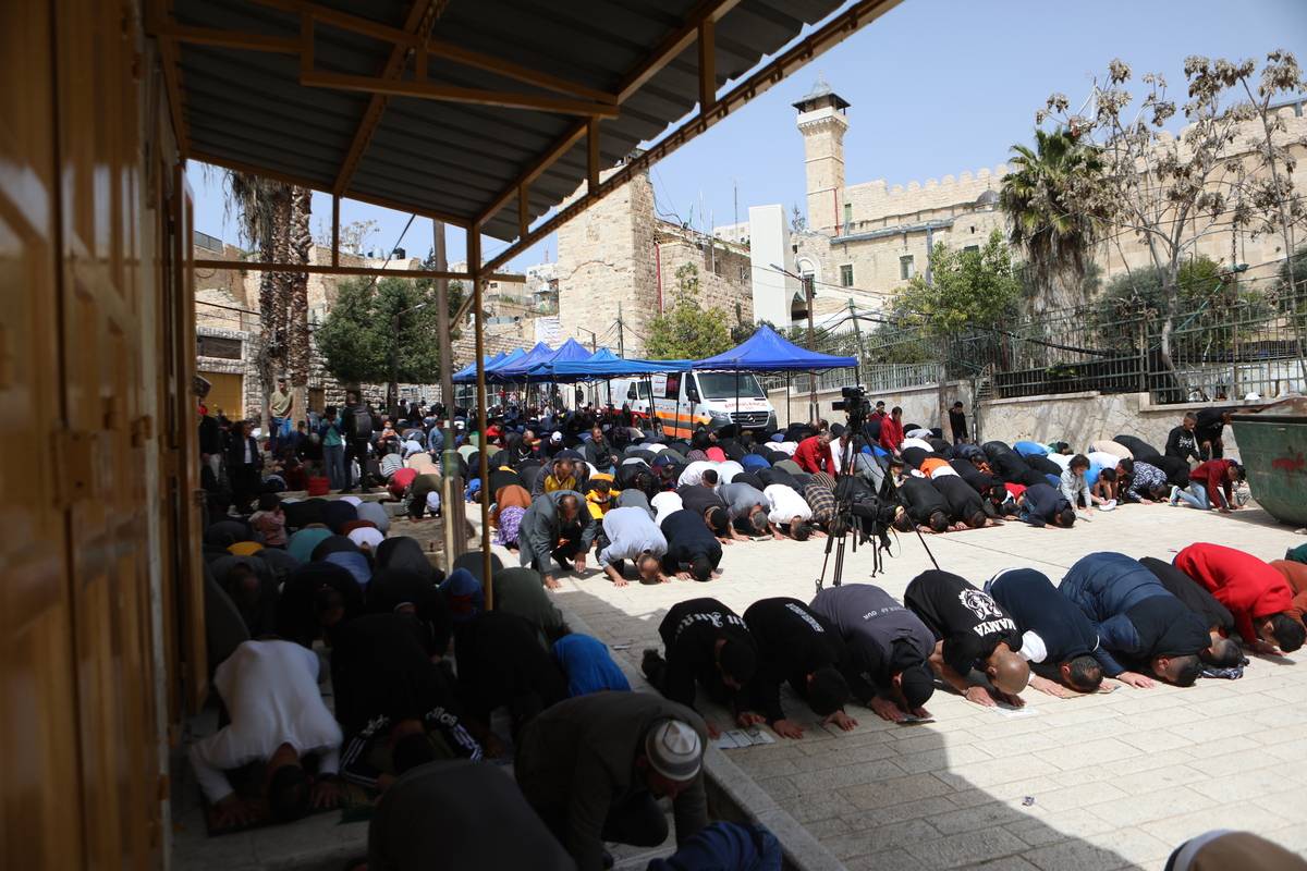 Palestinians perform the first Friday prayer in the holy month of Ramadan at Ibrahimi Mosque in Hebron, West Bank on March 24, 2023 [Mamoun Wazwaz/Anadolu Agency]
