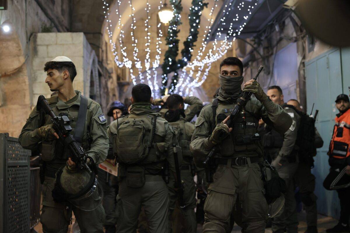 Israeli police force people out of the Chain Gate as they raid Masjid al-Aqsa in Jerusalem on April 05, 2023 [Mostafa Alkharouf/Anadolu Agency]