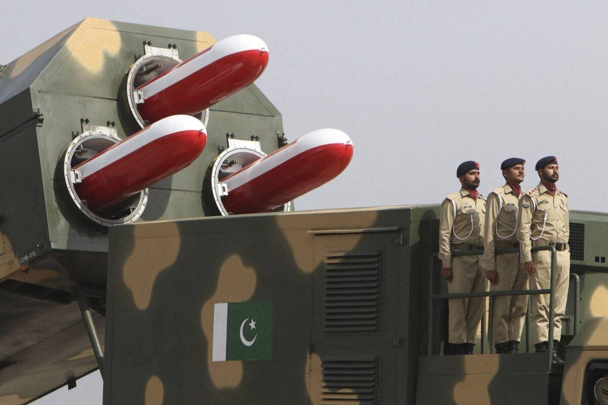 Pakistani army soldiers stand atop a military vehicle carrying missiles Babur during the Pakistan Day parade in Islamabad on March 23, 2022 [GHULAM RASOOL/AFP via Getty Images]