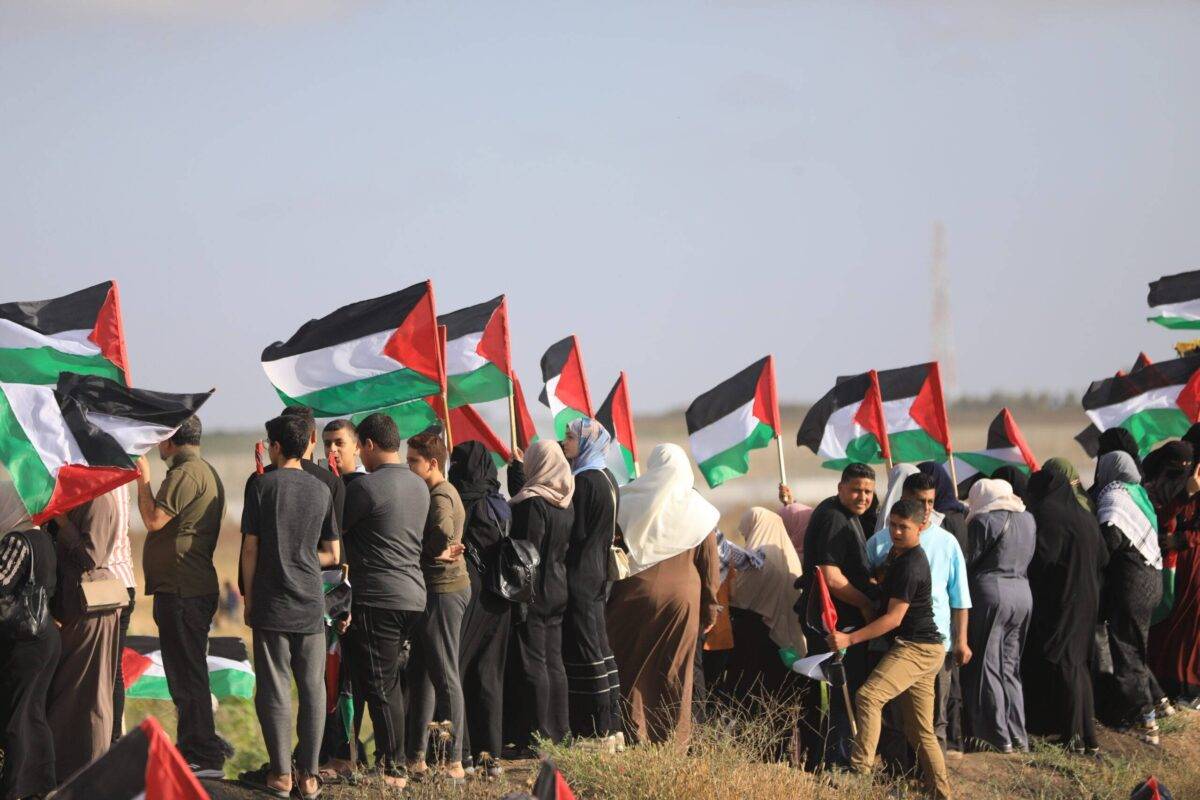 Thousands of Palestinians protests along the fence separating Gaza from Israel against the racist Flag March taking place in occupied East Jerusalem on 18 May 2023 [Mohammed Asad/MiddleEastMonitor]