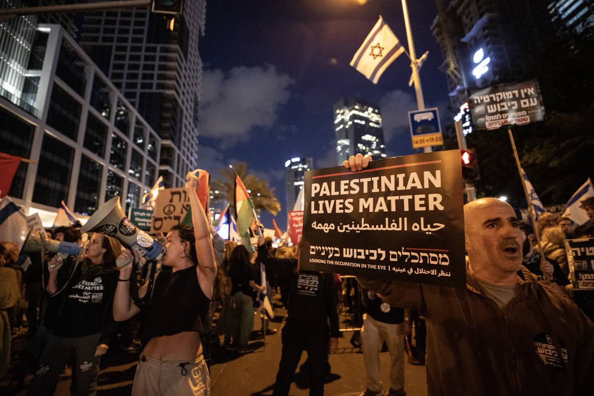 Demonstrators holding placards and Israeli flags gather for a rally to protest the Israeli government's judicial overhaul bill in Tel Aviv, Israel on April 29, 2023 [Mostafa Alkharouf - Anadolu Agency]
