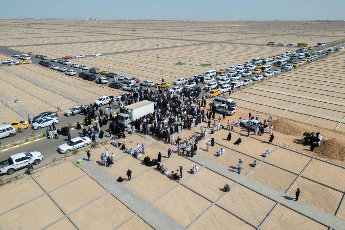 People attend the funeral of 45 unidentified victims killed by Daesh/ISIS terrorists exhumed from a mass grave near a jail in Badoush, Nineveh Governorate and transported to a cemetery in Najaf, Iraq on May 16, 2023 [Karrar Essa - Anadolu Agency]